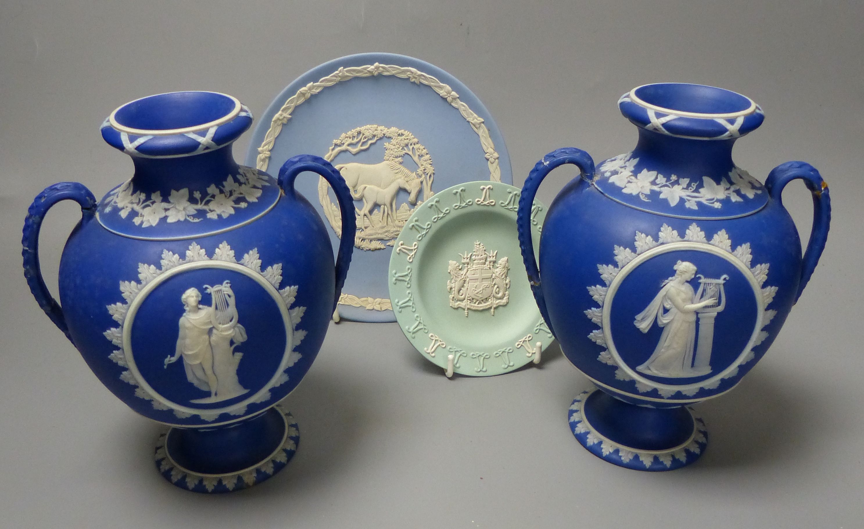Four pieces of Wedgwood jasper wares including a pair of Victorian blue jasper vases, height 18.5cm, and later dish and pin dish